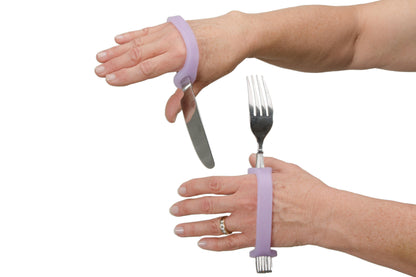 Person using a purple EazyHold grip tool to assist with holding a knife and fork.